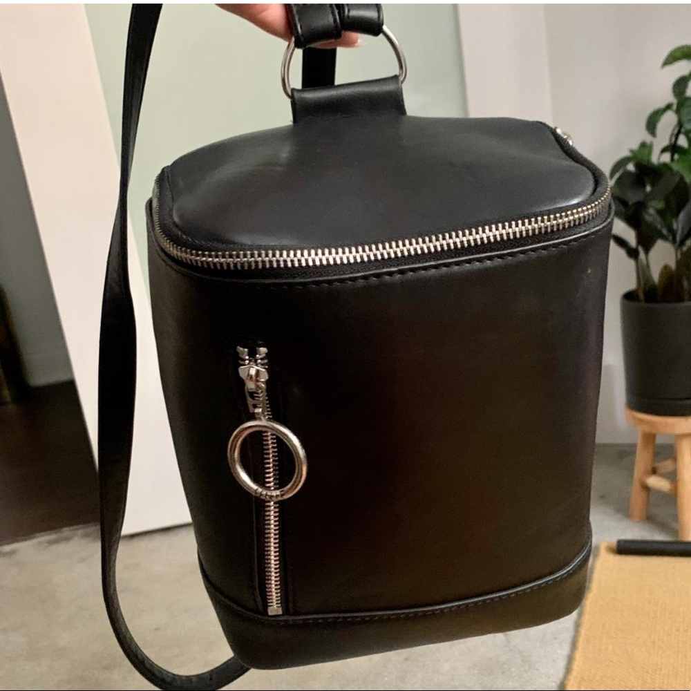 UNIF barrel style mini backpack, black with silver hardware